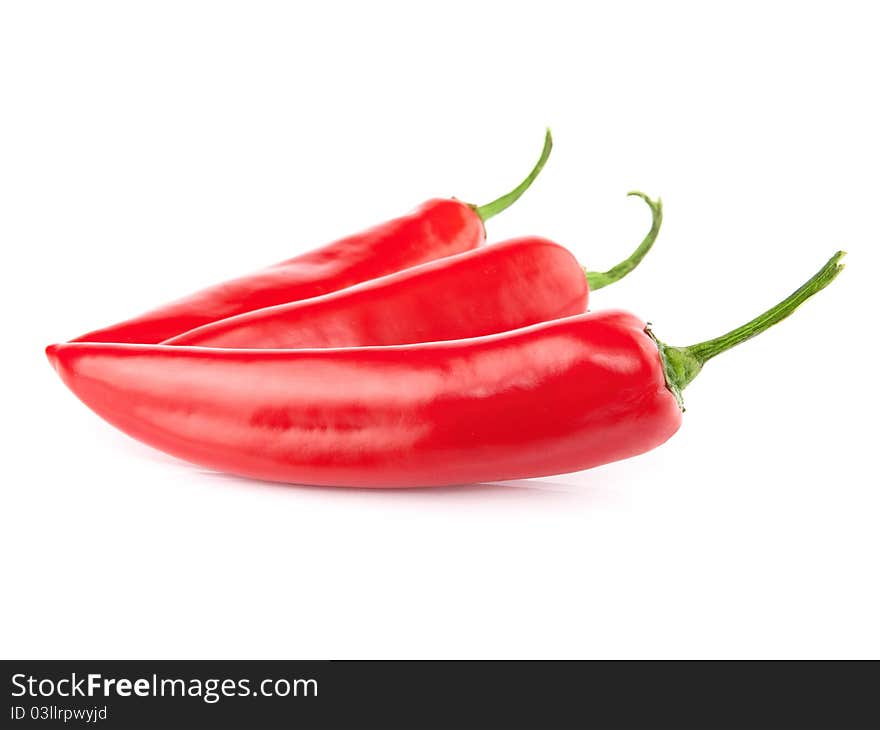 Three red hot chili pepper isolated on a white background