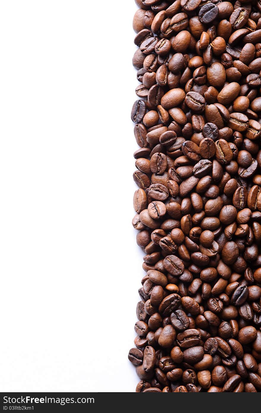 Aromatic coffee beans against a white background