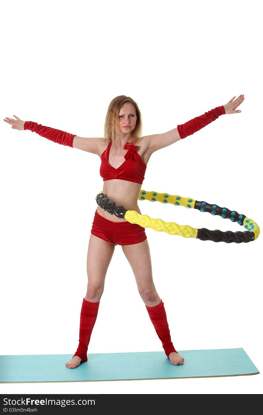 Young gymnast girl doing exercises with hula-hoop. Young gymnast girl doing exercises with hula-hoop