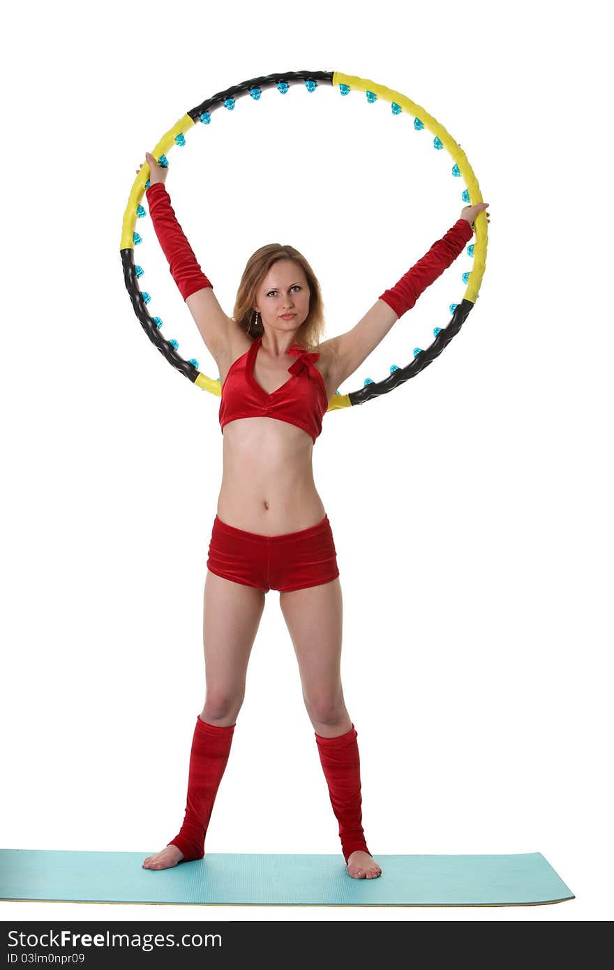 Young gymnast girl doing exercises with hula-hoop. Young gymnast girl doing exercises with hula-hoop