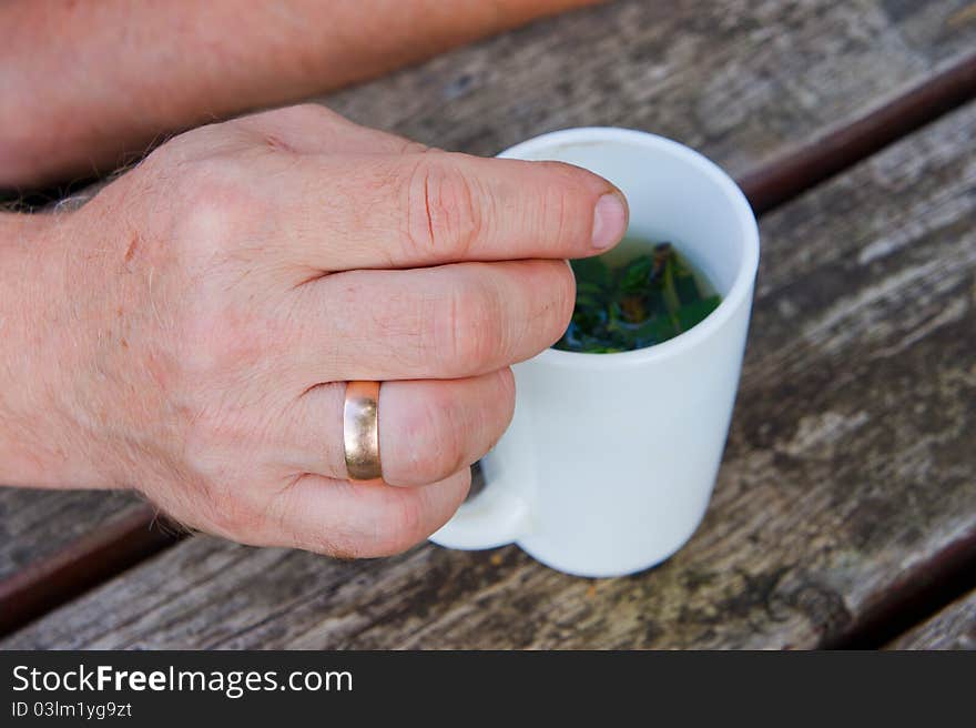 Hand an elderly man and a white circle. Hand an elderly man and a white circle