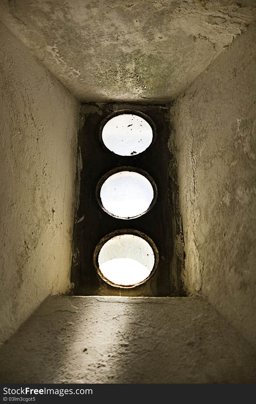 Circle windows in basement of old building