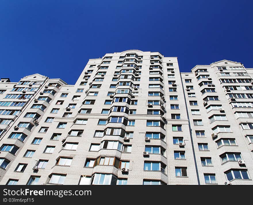 Modern apartment house against the sky in a city.