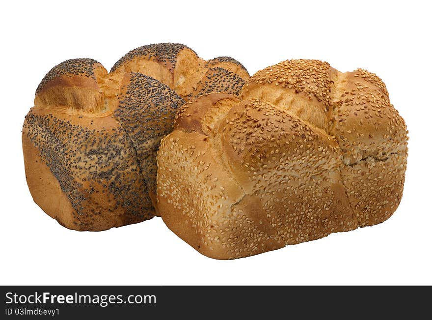 Two loaves of  fresh wheat  bread with poppy and sesame seeds, isolated on white background.