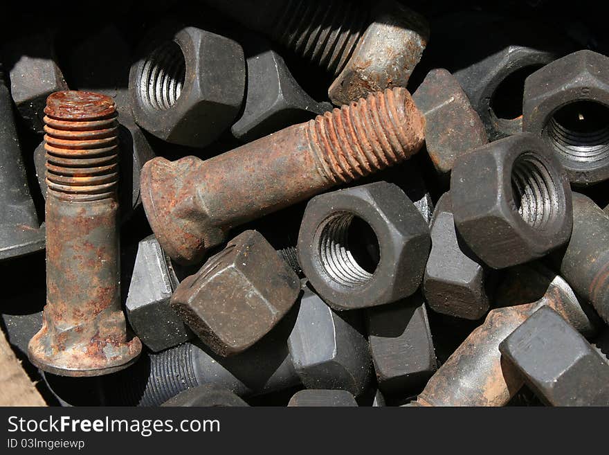 Nuts and bolts iron in the form of background