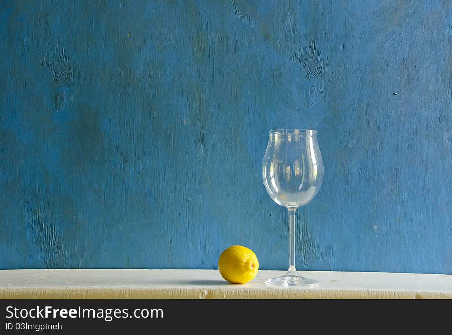 Still-life With Lemon And Empty Wineglass