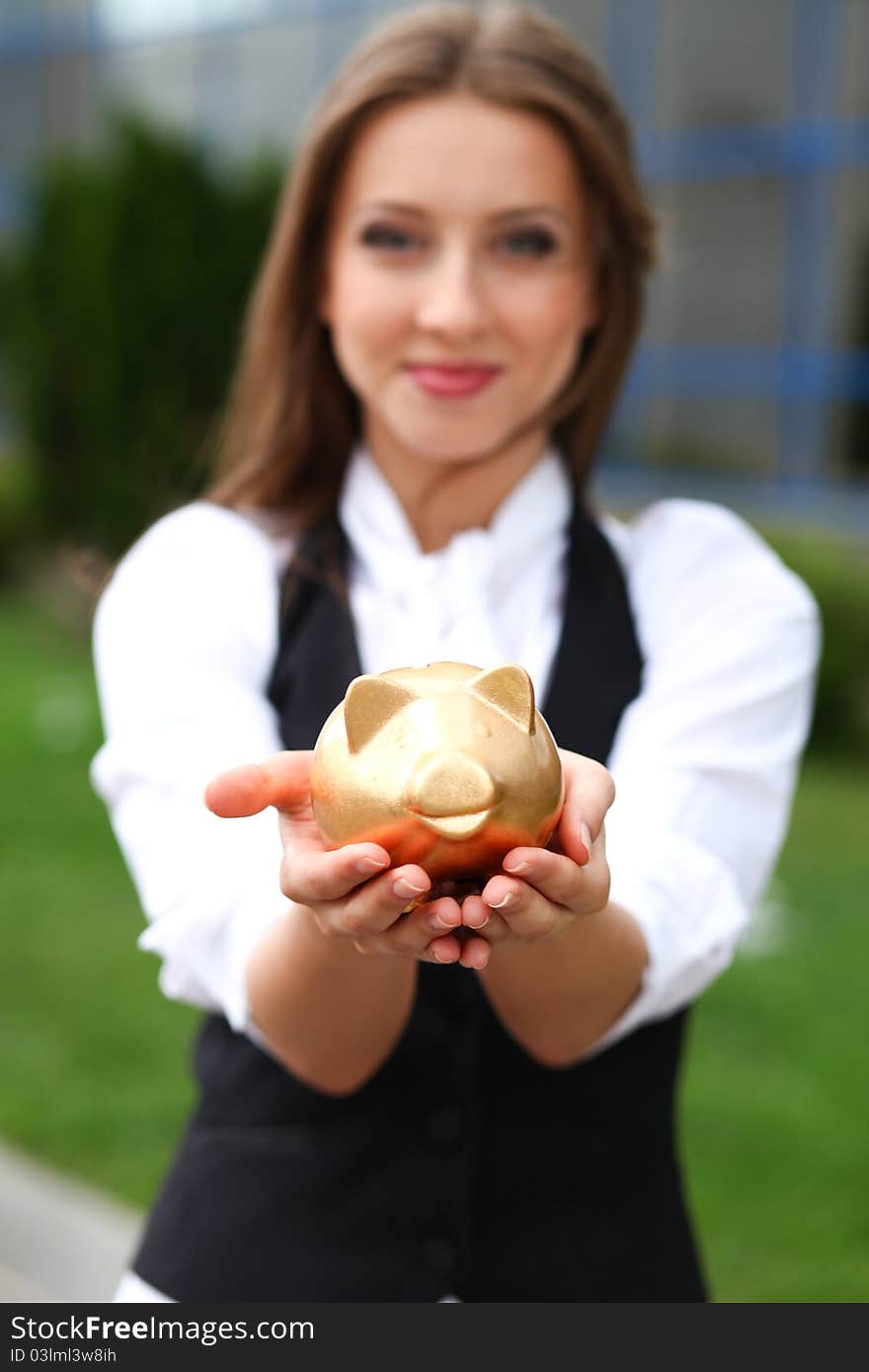 Businesswoman with moneybox