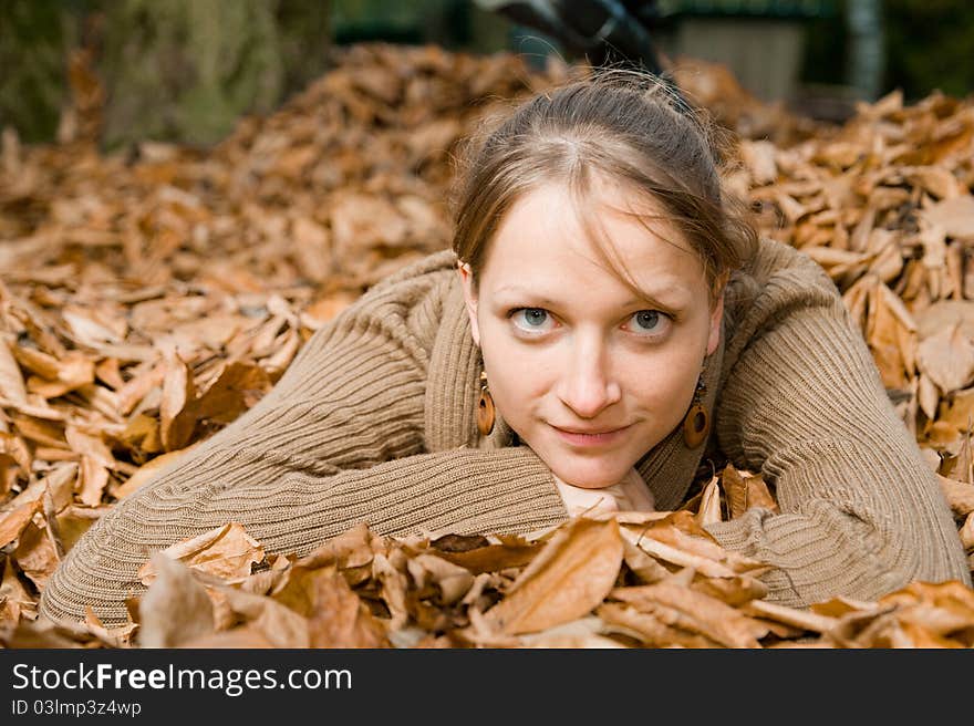 Woman In Fall Leaves