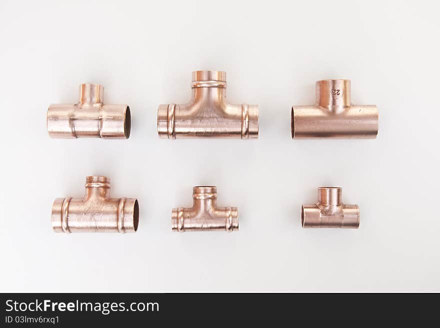 Different types of copper plumbing soldered tee fittings. Different types of copper plumbing soldered tee fittings