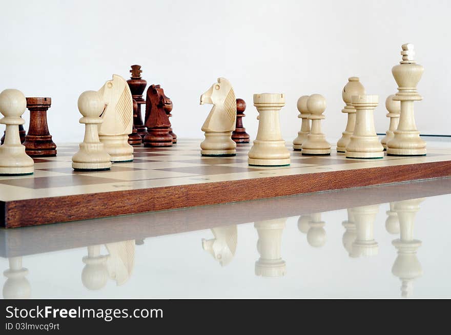 Chess pieces on wood board