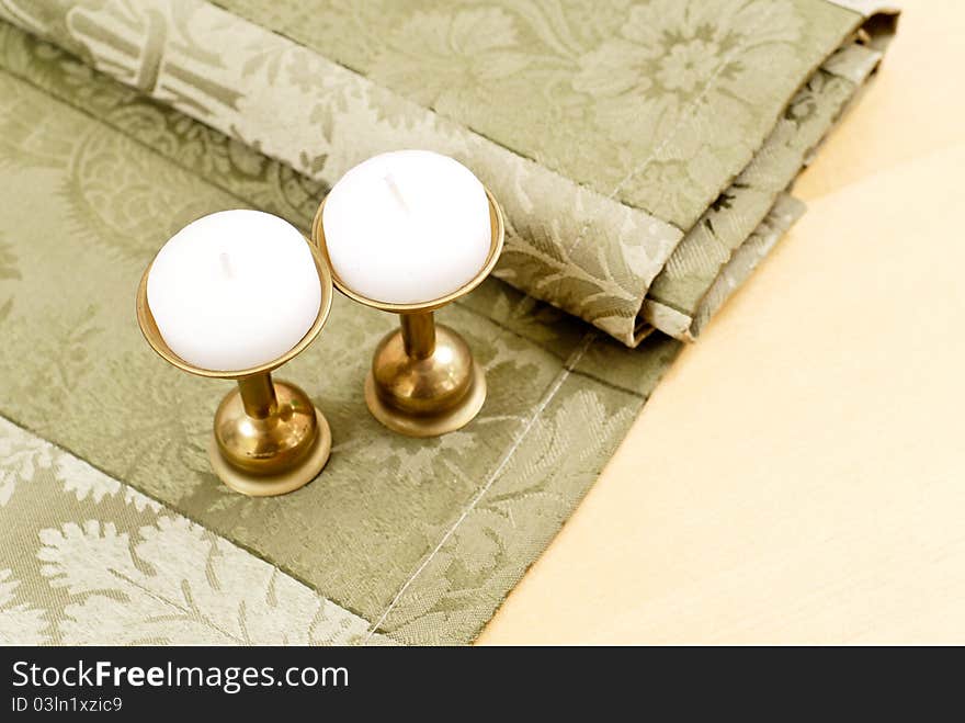 Decorative Candles On Folded Table Cloth