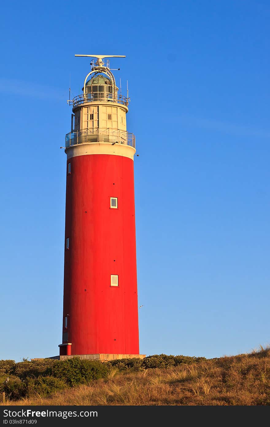 Seaside with sand dunes and  lighthouse