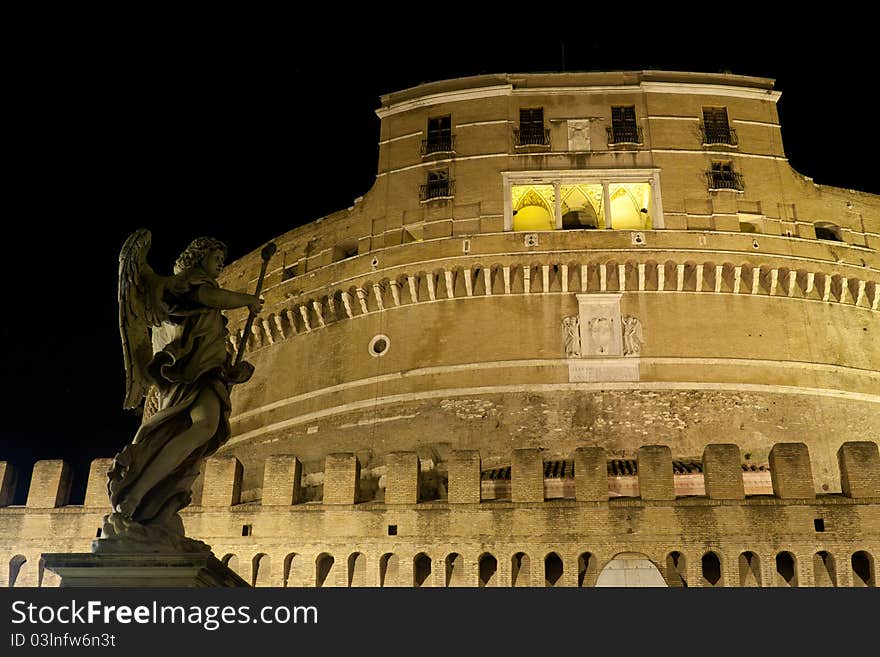 Castel Sant'Angelo in rome shot at night with a statue. Castel Sant'Angelo in rome shot at night with a statue