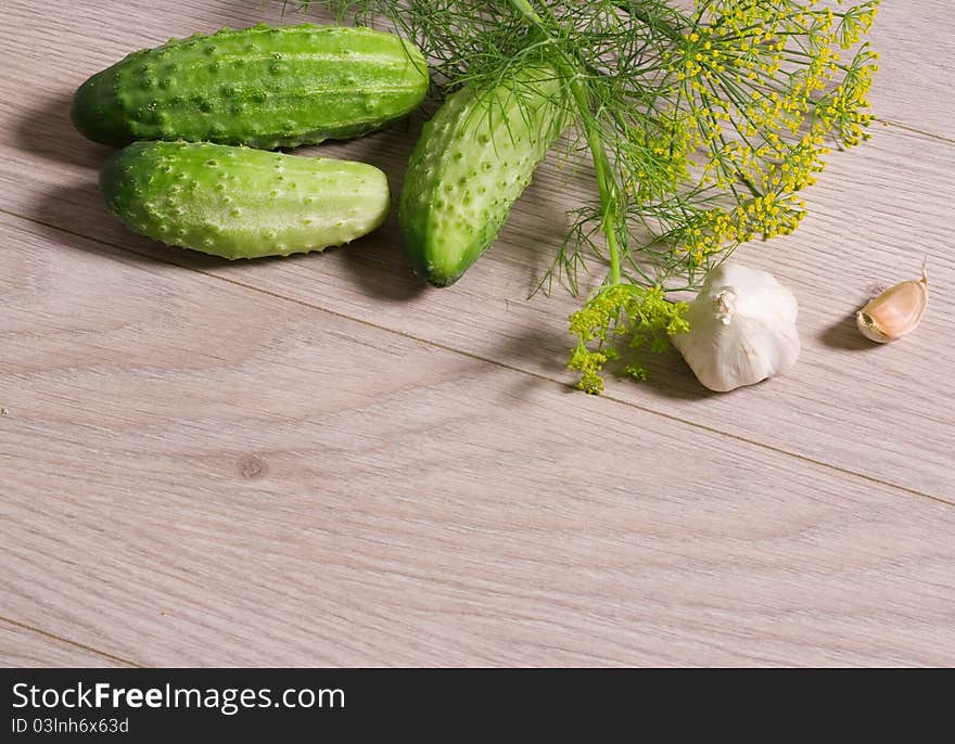 Fresh cucumbers on a wooden table