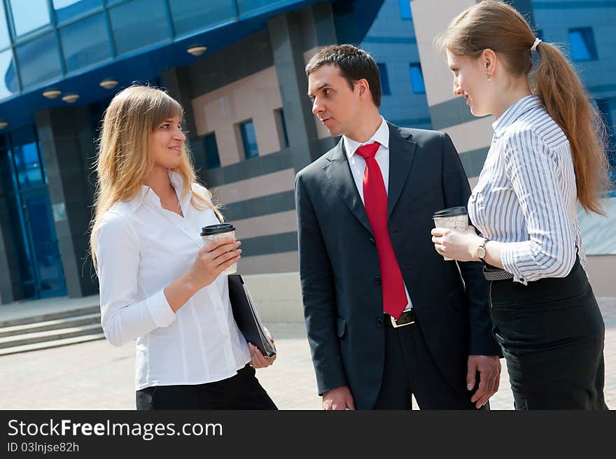 Business people have a coffee break in a modern downtown. Business people have a coffee break in a modern downtown.