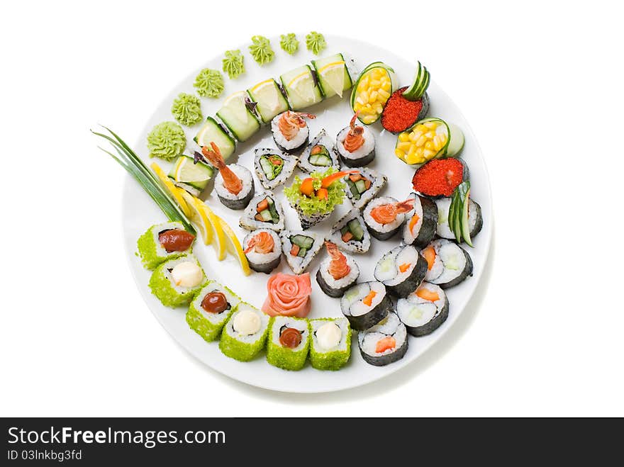 Photo of a rolled and sushi on the white plate