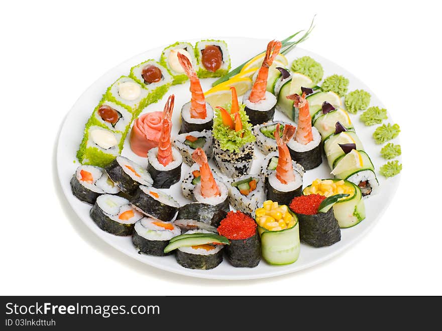 Photo of a rolled and sushi on the white plate