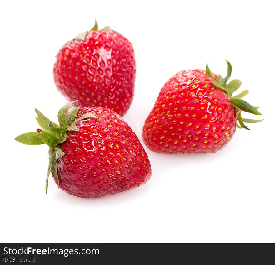 Three sweet strawberry isolated on white