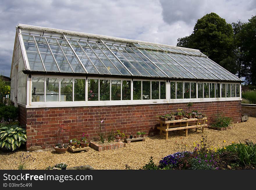 A commercial greenhouse in a garden centre. A commercial greenhouse in a garden centre