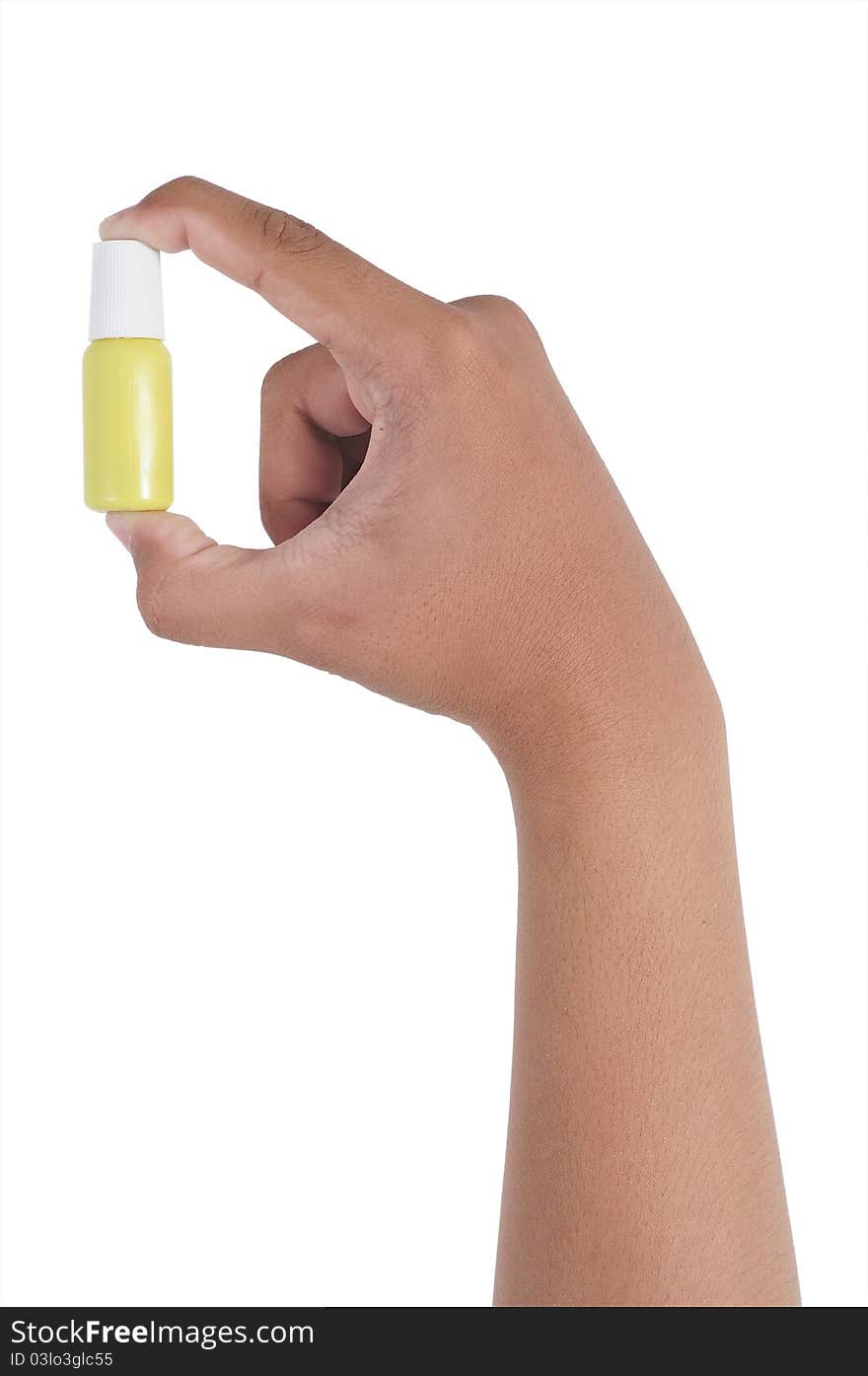 Small medicine bottle in hand isolated on white background