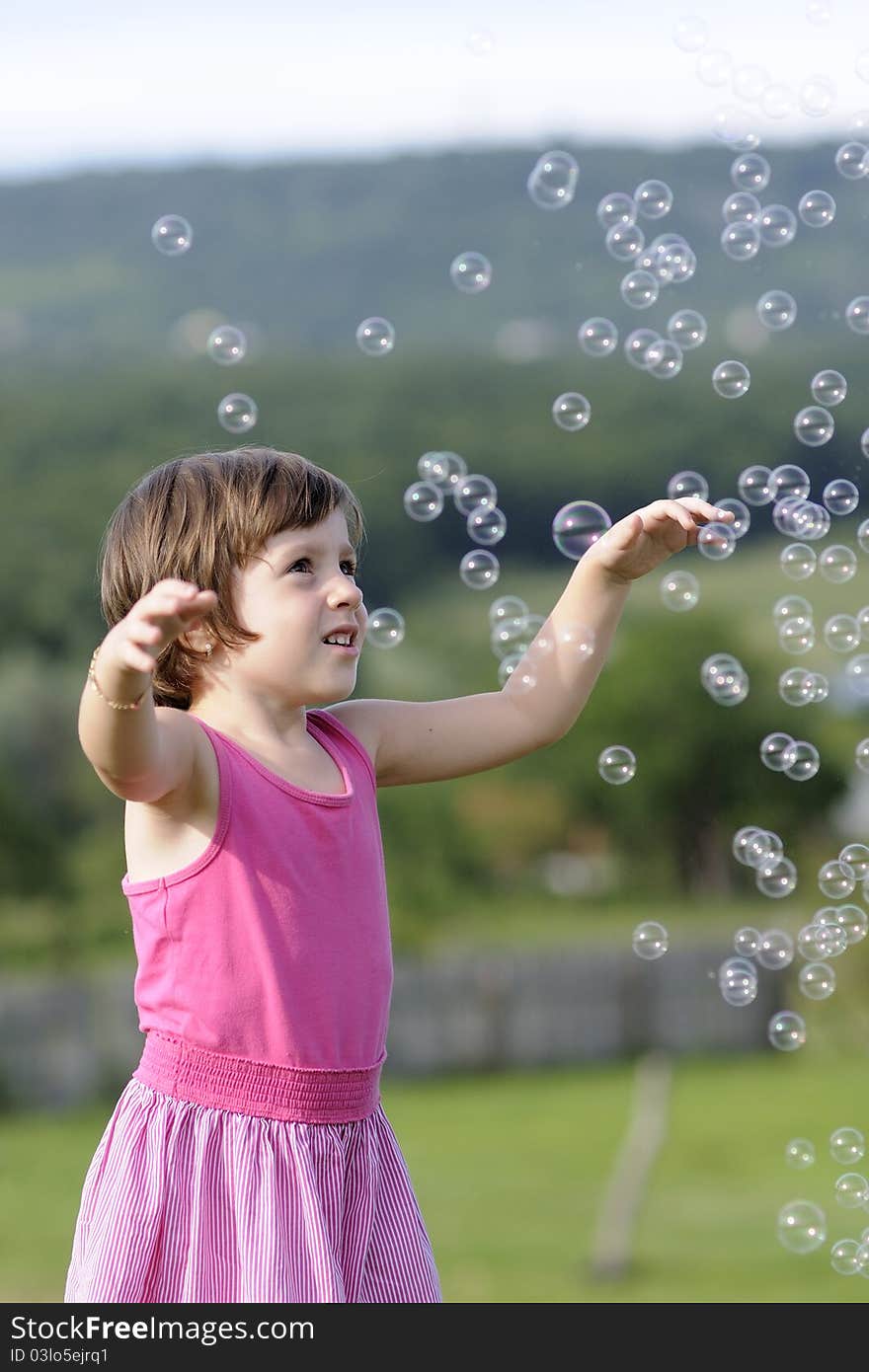 Child playing with balloons