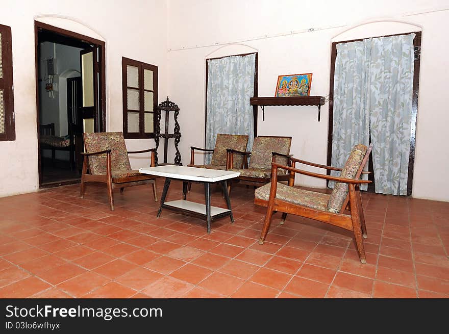 An old traditional indian house with furniture on display. An old traditional indian house with furniture on display