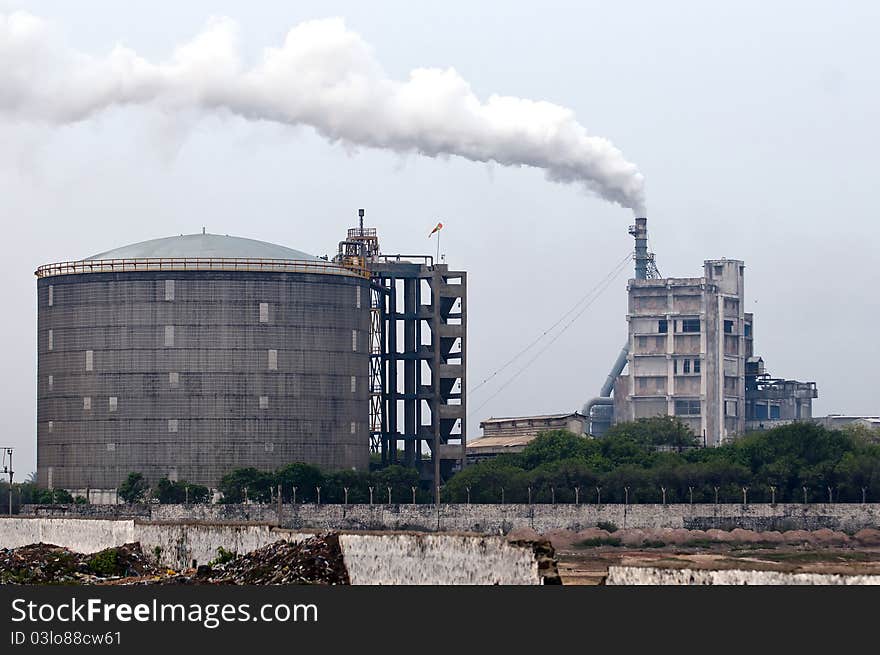 An old factory emitting hazadarous gases into the environment. An old factory emitting hazadarous gases into the environment