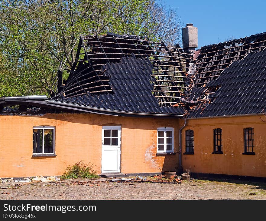 Ruin and remains of a burned down house