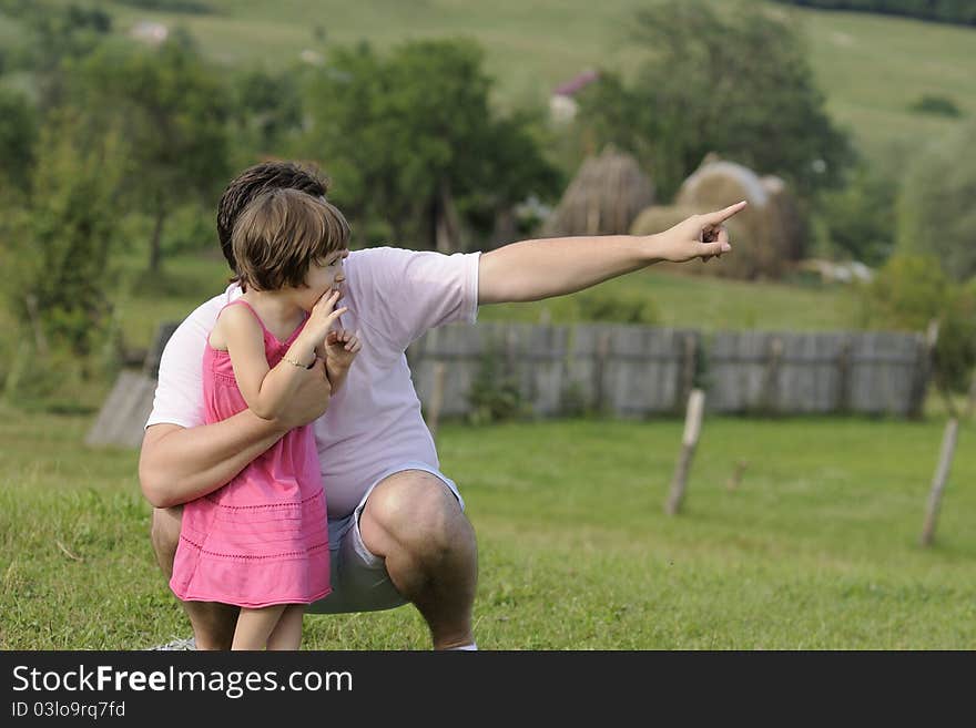 Young father analyzing together with his little girl beauty of nature. Young father analyzing together with his little girl beauty of nature