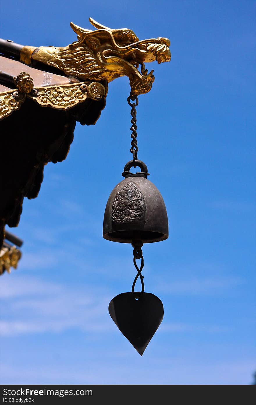 Chinese style dragon statue with bell.