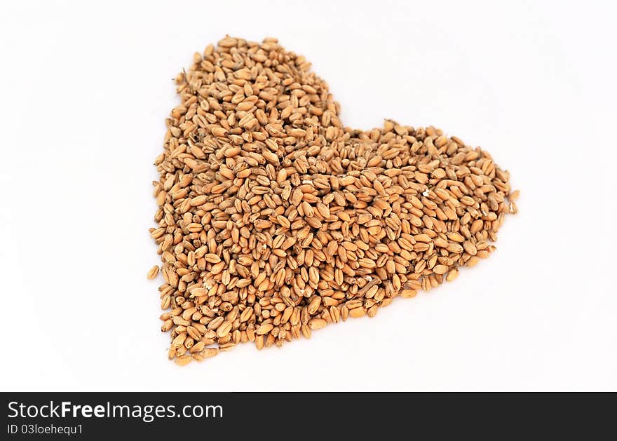 A wheat berry heart shape isolated on white - valentines day