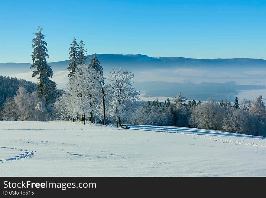 View of the snowy landscape and small town Kraliky on the border of Poland and the Czech Republic (Eastern Europe)