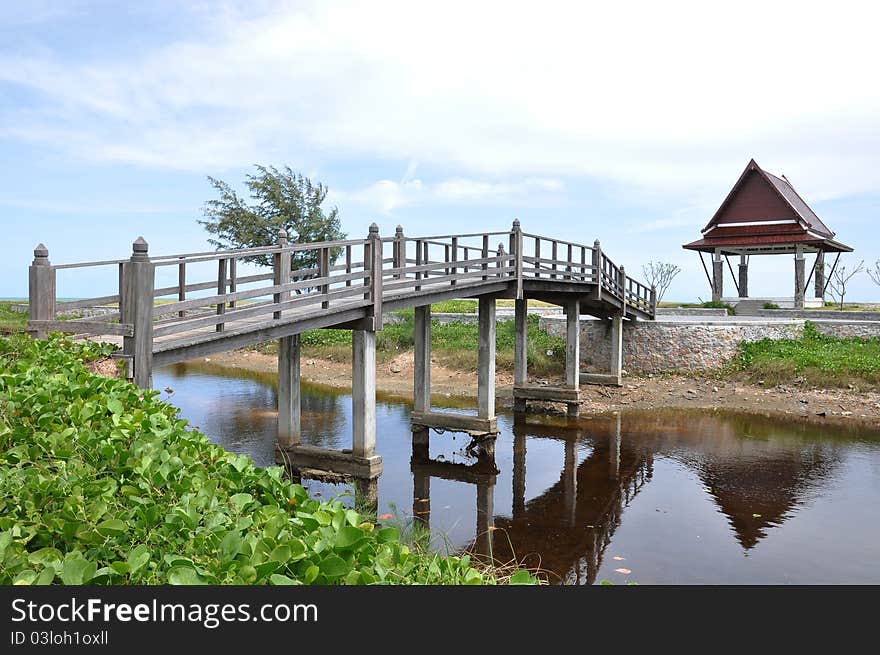 Wooden bridge at garden with blue sky