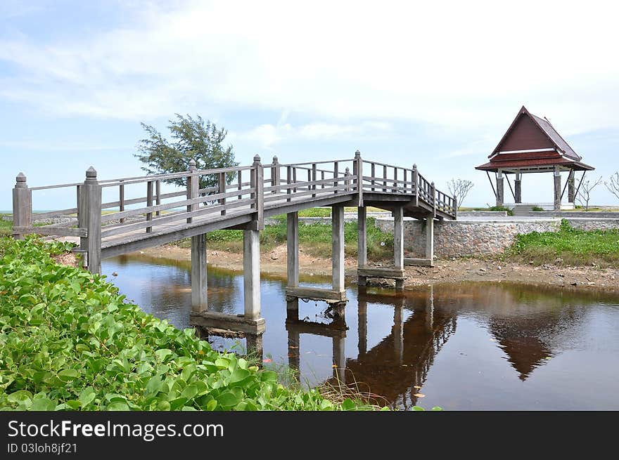 Wooden bridge at garden with blue sky