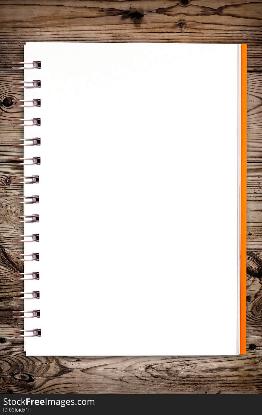 White notebook on wooden background