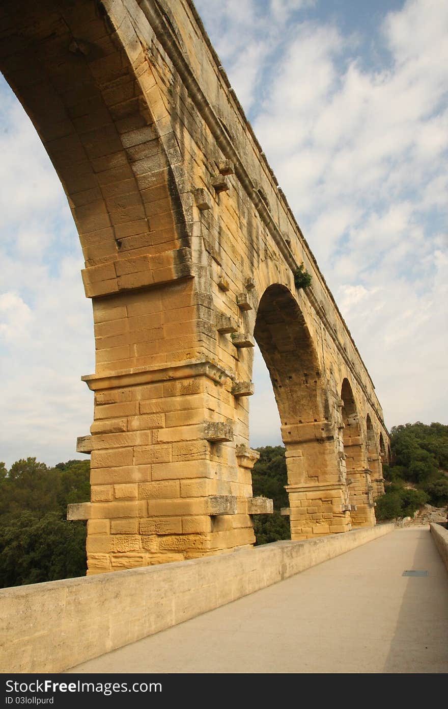 Ancient roman aqueduct bridge that crosses the gard river - part of a 50 km long aqueduct. Ancient roman aqueduct bridge that crosses the gard river - part of a 50 km long aqueduct