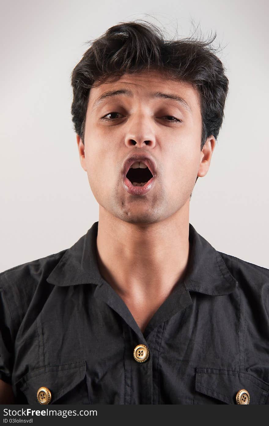 excited indian man with mouth wide open as if yelling loudly. excited indian man with mouth wide open as if yelling loudly