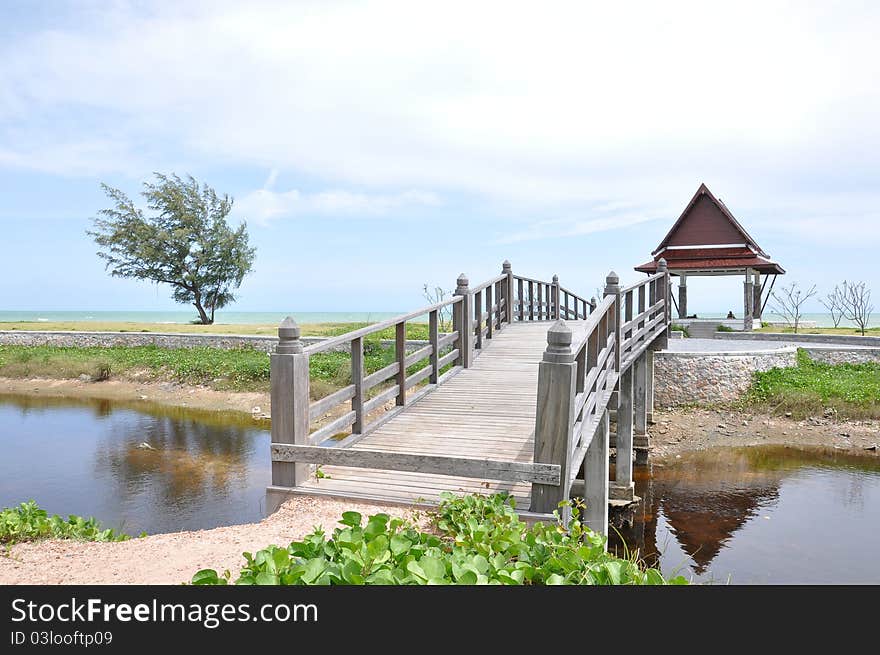 Wooden bridge at garden with blue sky