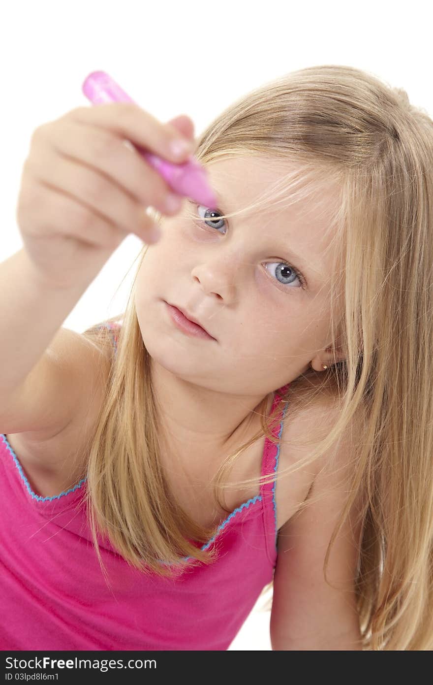 Little blonde girl holding a pink crayon out to camera on white background. Little blonde girl holding a pink crayon out to camera on white background.