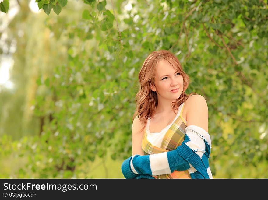 Young woman being happy in the park. Young woman being happy in the park