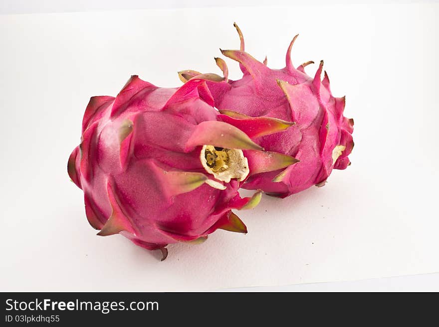 Red organic dragon fruit on white background