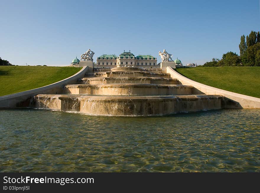 Fountain and Upper Belvedere illuminated with golden sunshine.