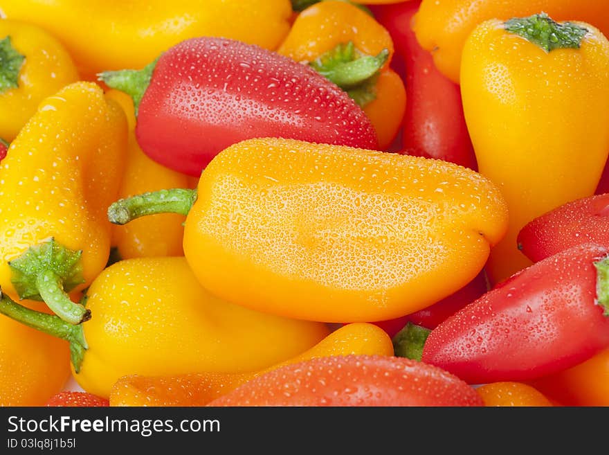 A group of baby peppers against a white background