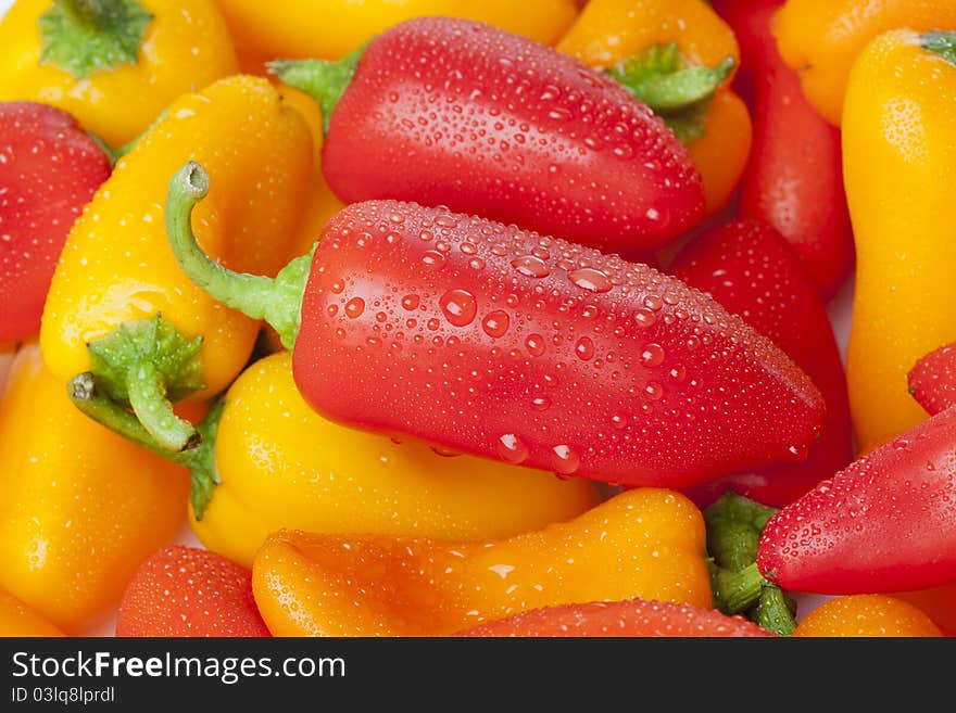 A group of baby peppers against a white background