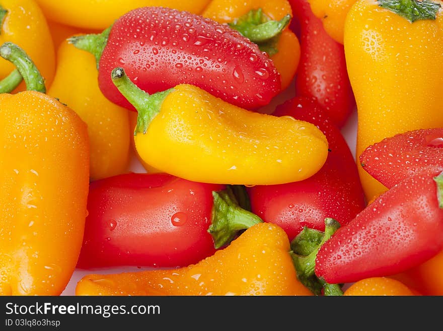 A group of baby peppers against a white background