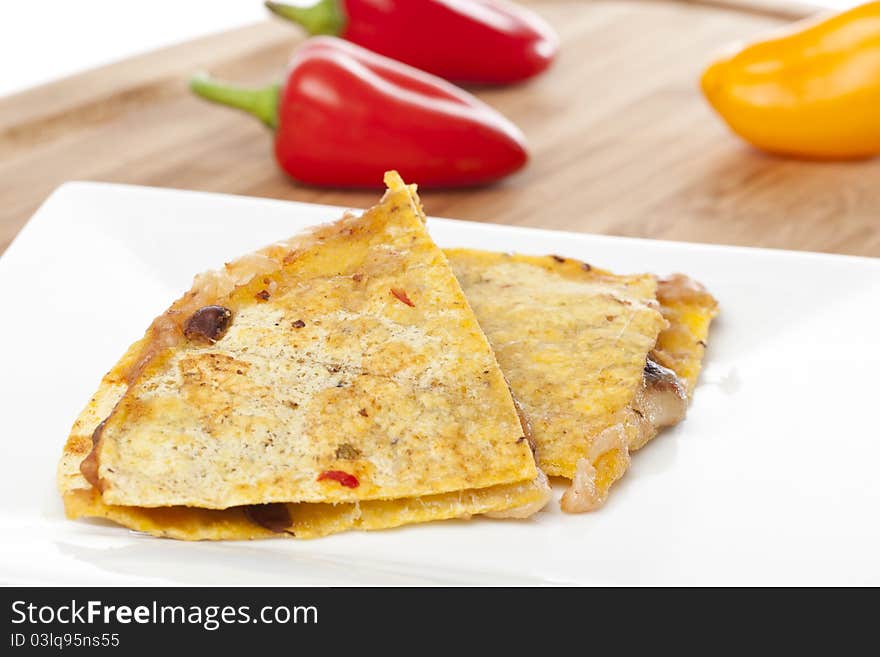 A cheese quesadilla against a white background