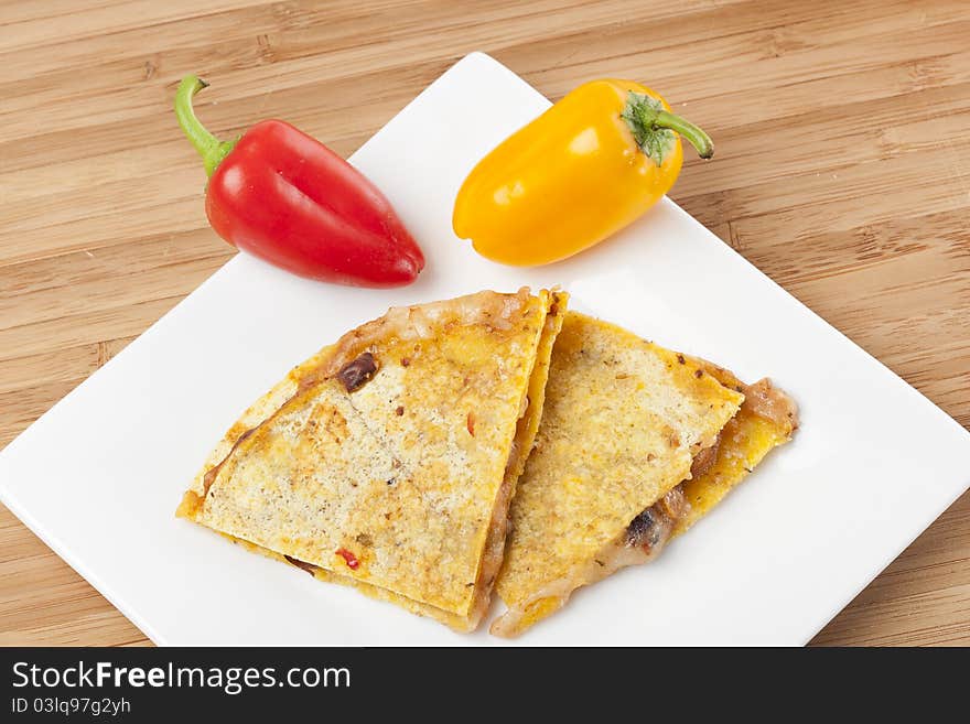 A cheese quesadilla against a white background