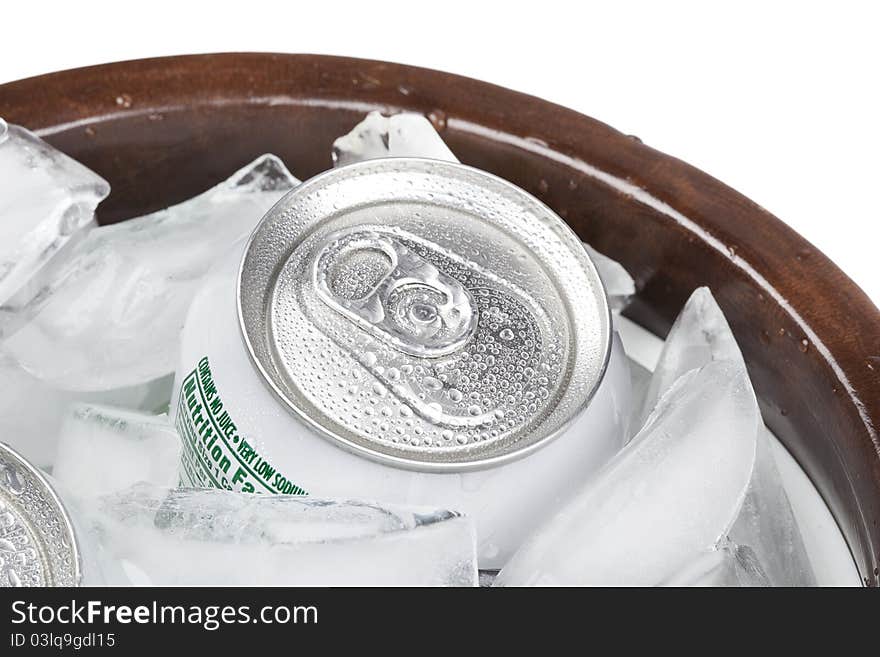 A group of soda cans in a container of ice