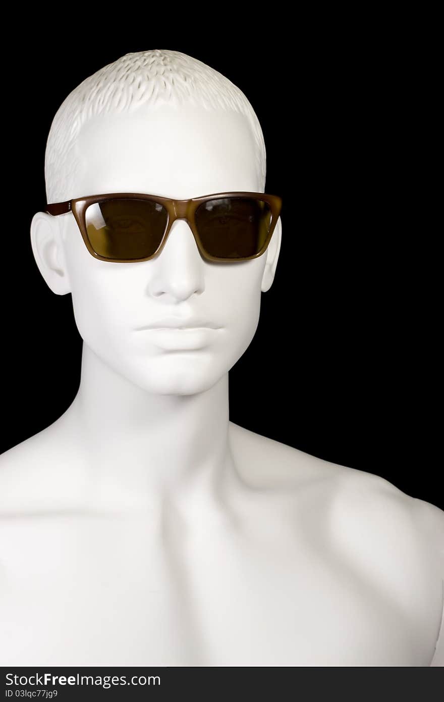 A handsome male mannequin wearing vintage wayfarer style sunglasses. A handsome male mannequin wearing vintage wayfarer style sunglasses