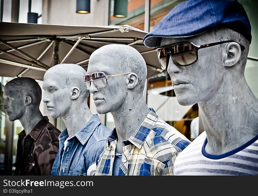 Male dolls in line dressed with young fashion. Male dolls in line dressed with young fashion.